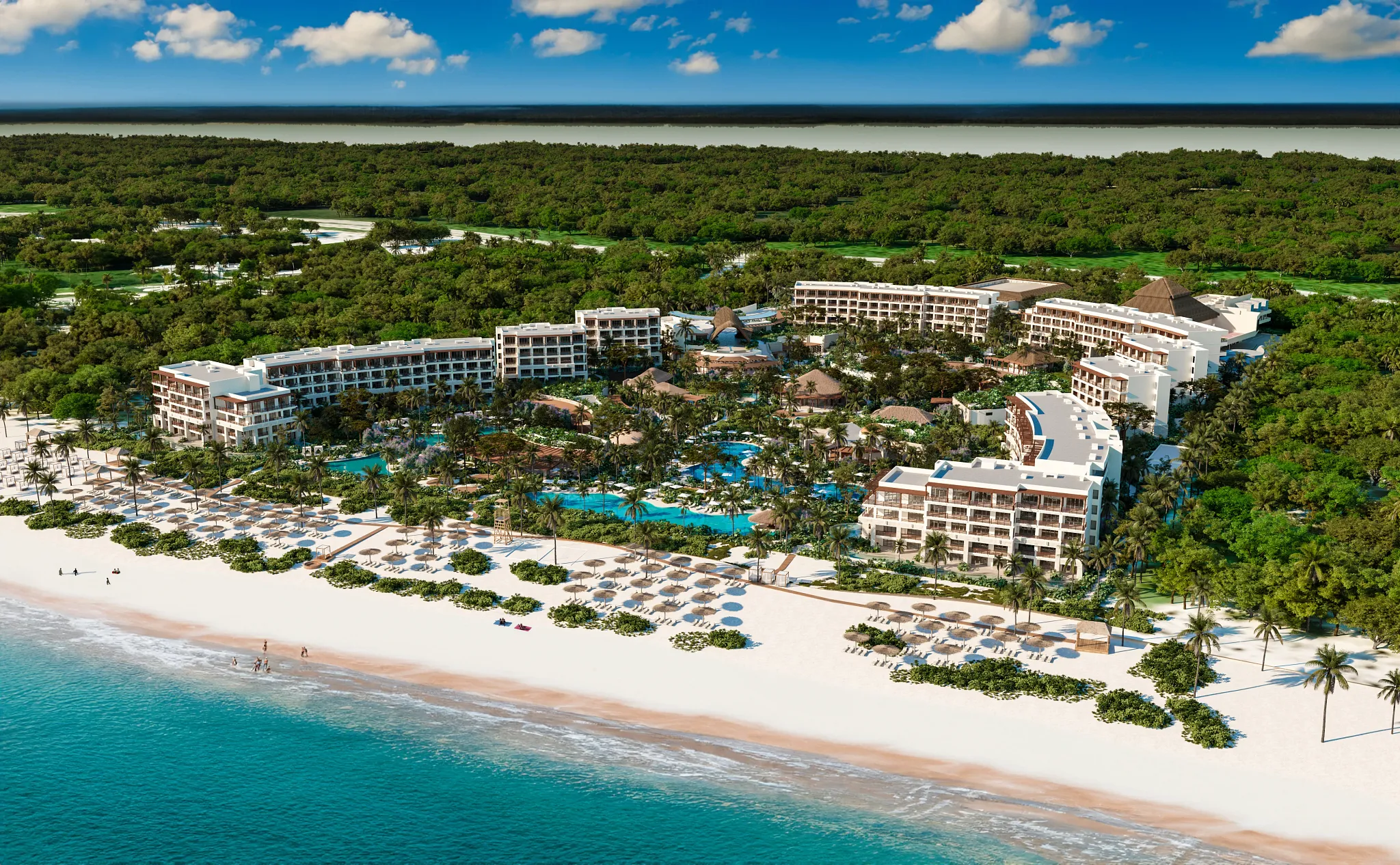 Aerial view of Secrets Playa Blanca Costa Mujeres beachfront resort with pools, lush landscaping, and white sand beach along the Caribbean Sea.