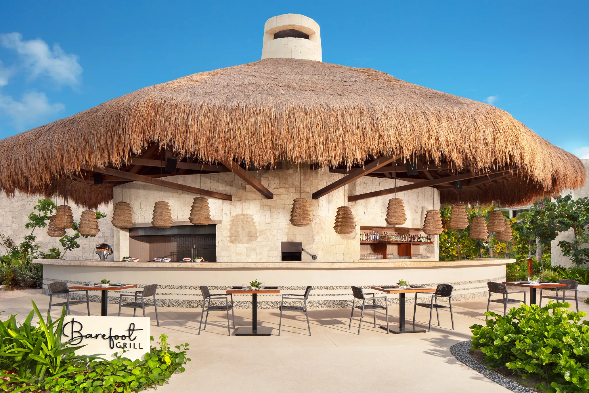 Barefoot Grill at Secrets Playa Blanca Costa Mujeres featuring a relaxed beachfront dining setting with light lunch favorites and casual outdoor seating.