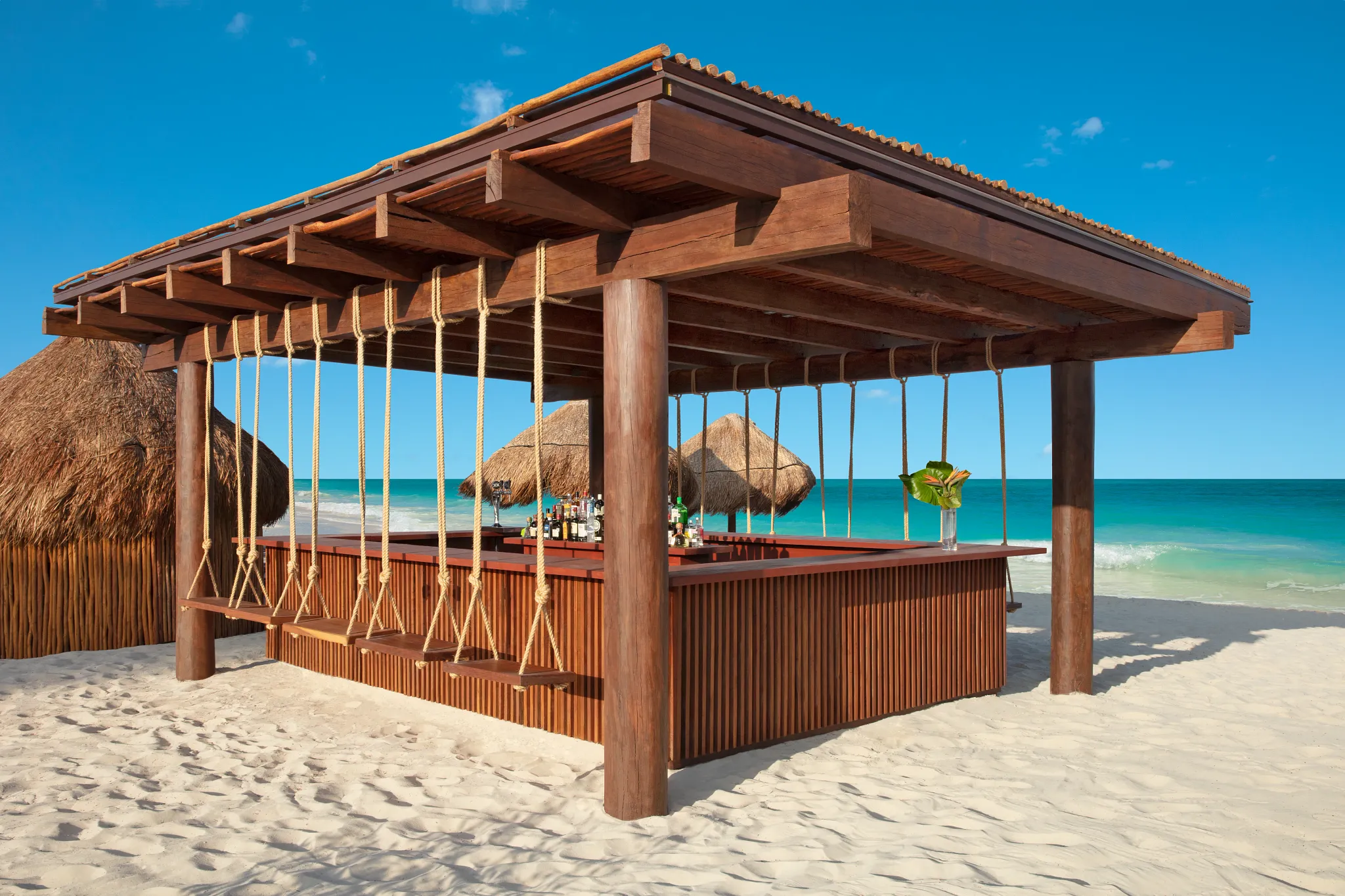 Barracuda Beach Bar at Secrets Playa Blanca Costa Mujeres with oceanfront views, tropical cocktails, and relaxed beachside seating.