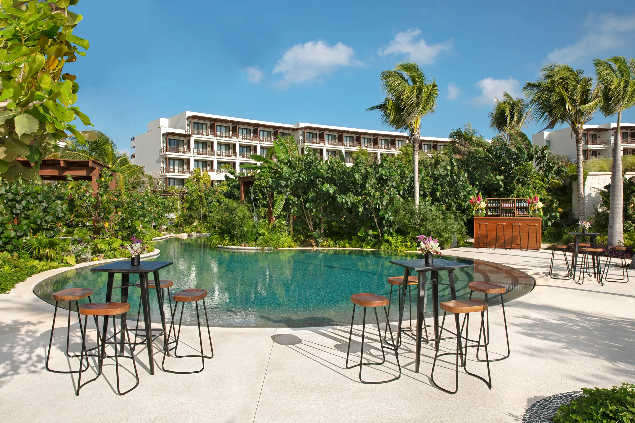 Jungle Pool Terrace cocktail setup with lagoon-style pool at Secrets Playa Blanca Costa Mujeres