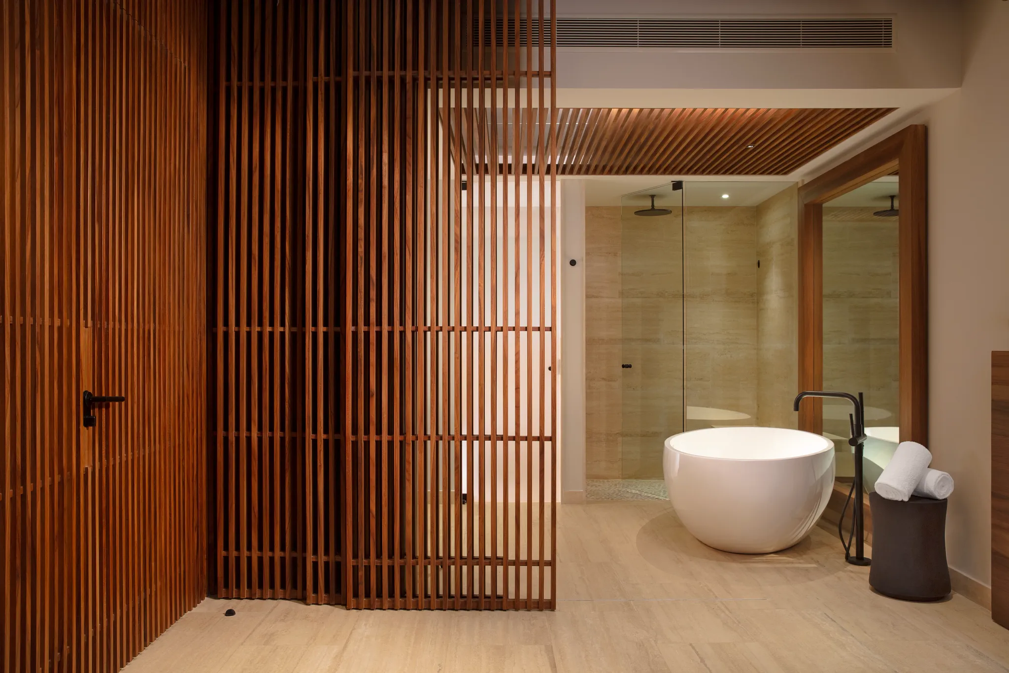 Junior Suite Ocean View bathroom with soaking tub for two and rain shower at Secrets Playa Blanca Costa Mujeres.
