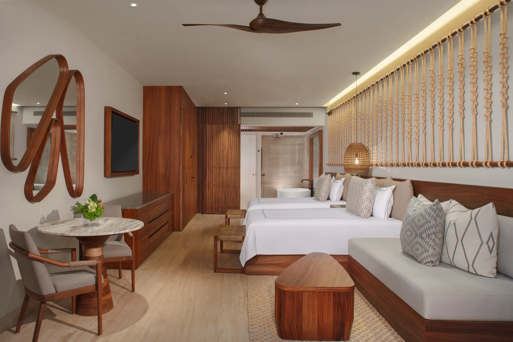 Junior Suite Ocean View with two double beds and modern tropical décor at Secrets Playa Blanca Costa Mujeres.