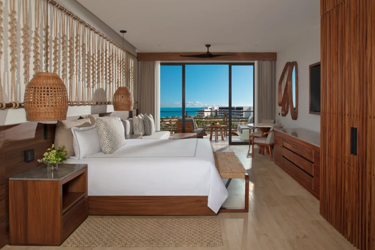Junior Suite Ocean View with king bed and private terrace overlooking the Caribbean Sea at Secrets Playa Blanca Costa Mujeres.