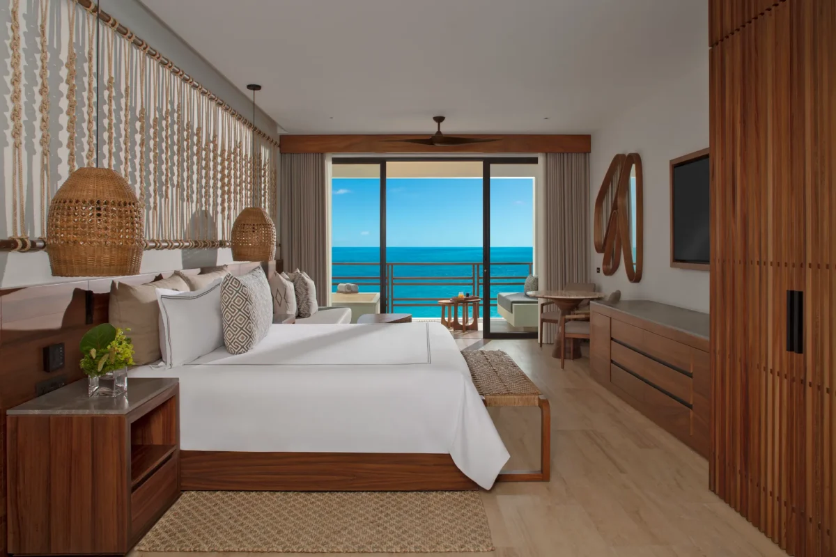 Preferred Club Junior Suite Ocean Front with king bed and private balcony overlooking the ocean at Secrets Playa Blanca Costa Mujeres.
