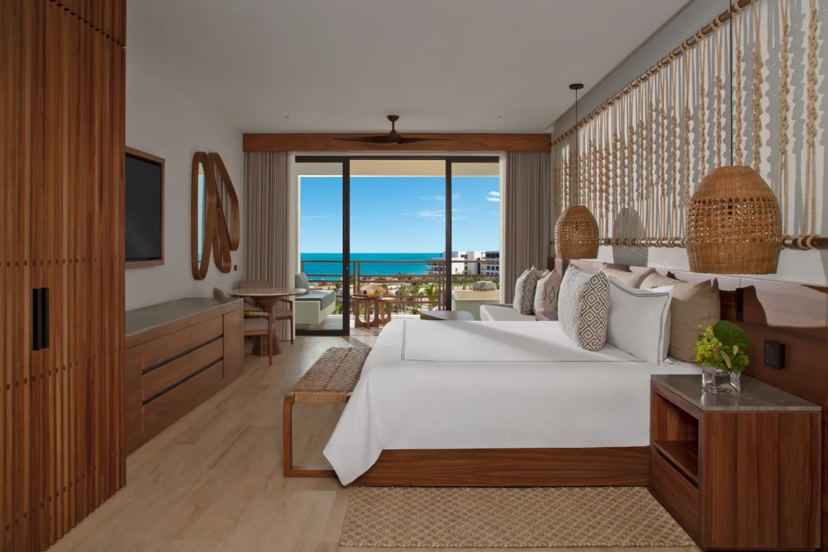 Preferred Club Junior Suite Ocean View with king bed and private balcony overlooking the Caribbean Sea at Secrets Playa Blanca Costa Mujeres.
