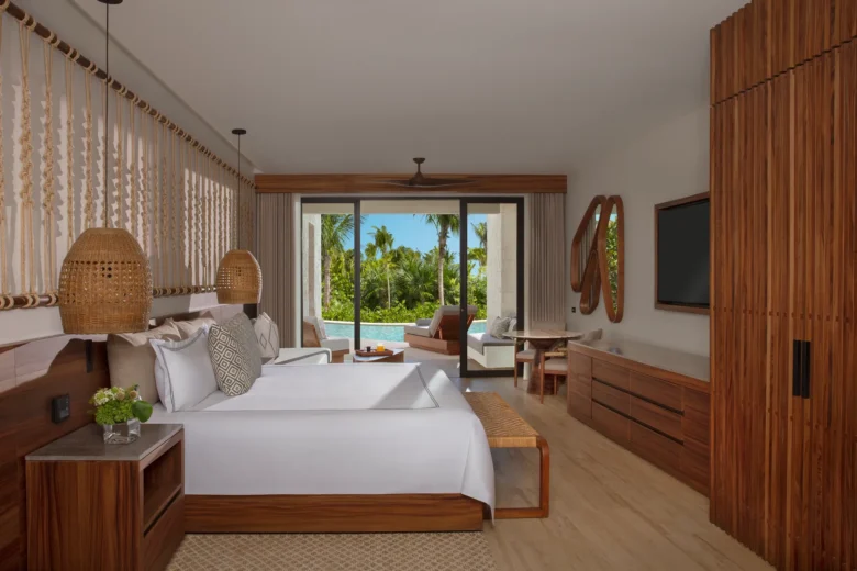 Preferred Club Junior Suite Swim Out with king bed and terrace leading to private pool at Secrets Playa Blanca Costa Mujeres.