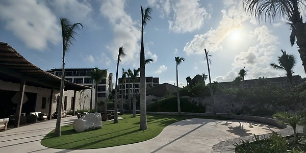 Preferred Garden venue lawn setup with palm trees at Secrets Playa Blanca Costa Mujeres