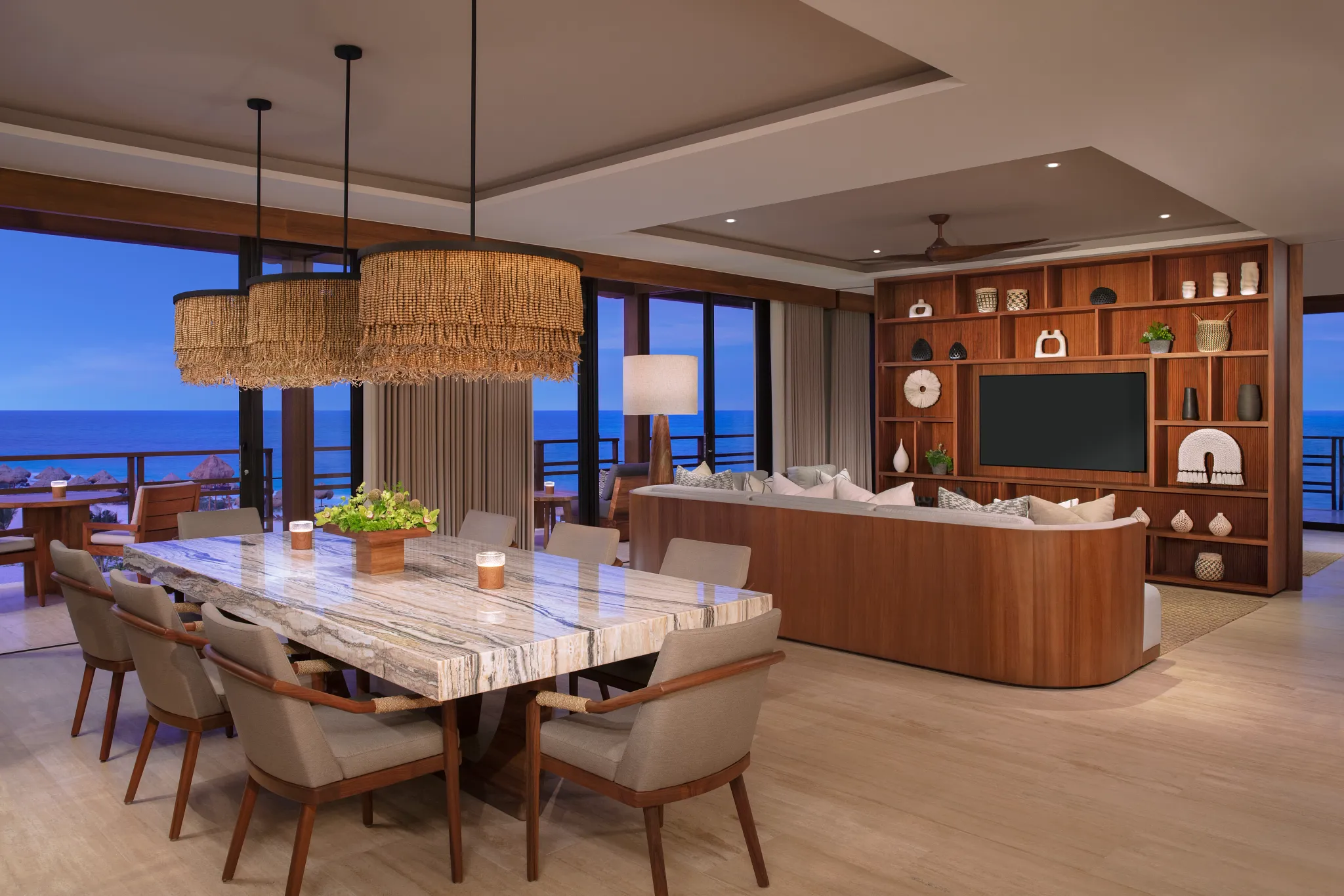 Spacious living room with sofa and oceanfront balcony in Presidential Suite at Secrets Playa Blanca Costa Mujeres.