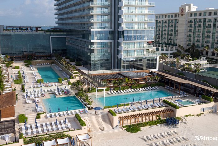 Secrets The Vine Cancun adults-only all-inclusive resort with sleek modern tower, beachfront pools, and Hotel Zone location in Cancun, Mexico.